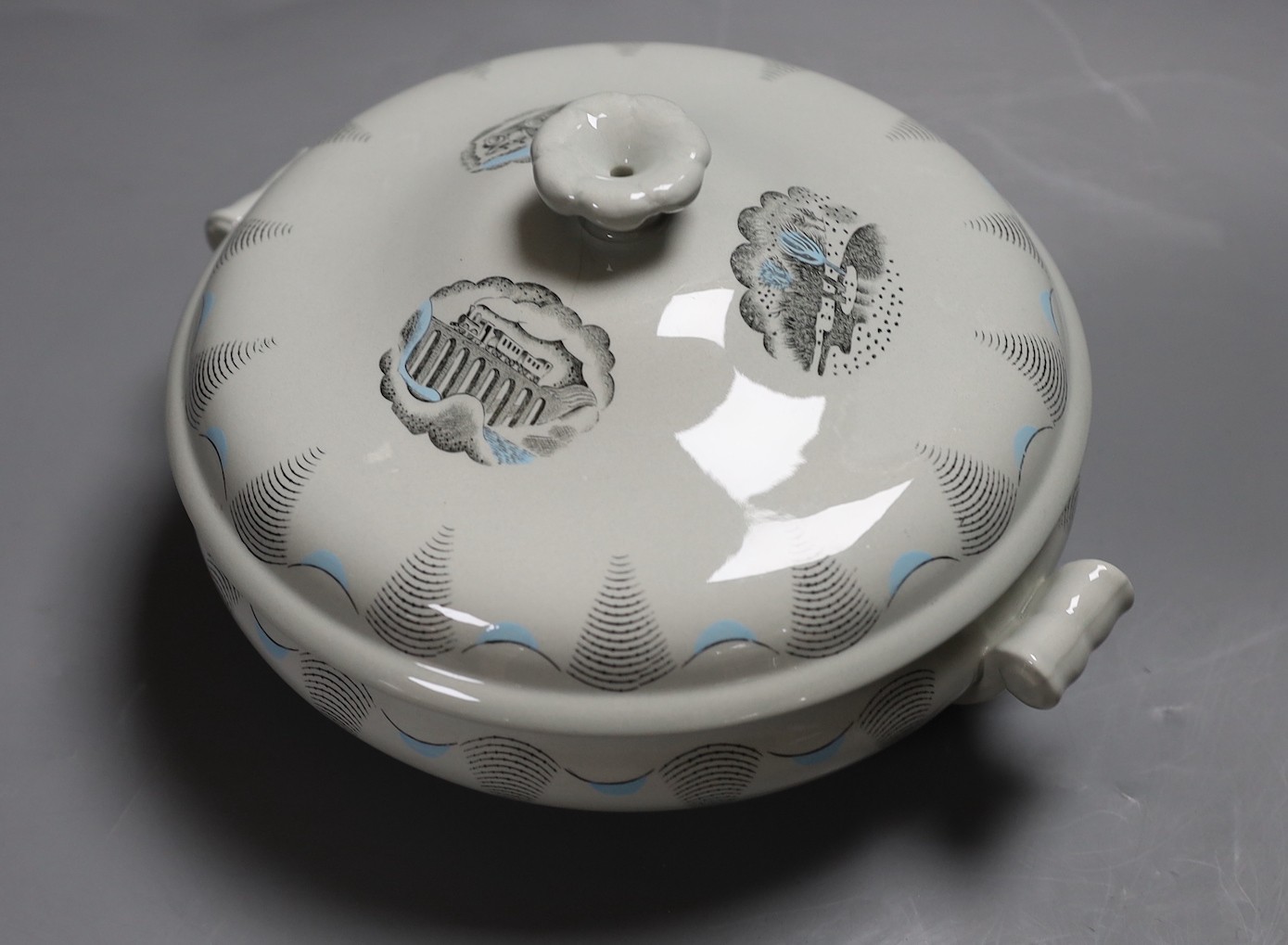 An Eric Ravilious for Wedgwood 'Travel' tureen and cover and a Chloe Cheese print of a Ravilious mug, unframed, tureen 24 cms wide